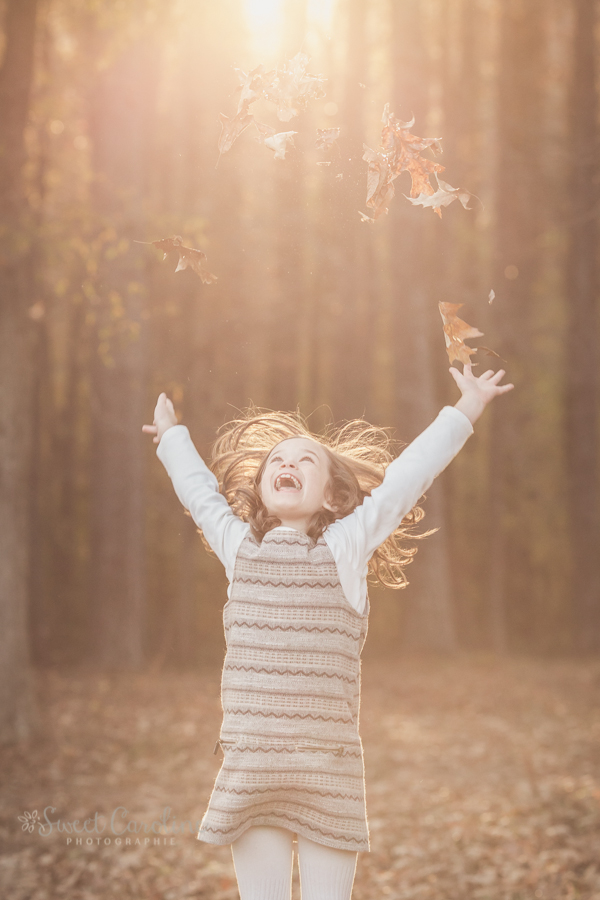 little girl playing in fall leaves | Chattanooga Child Photographer | Sweet Caroline Photographie