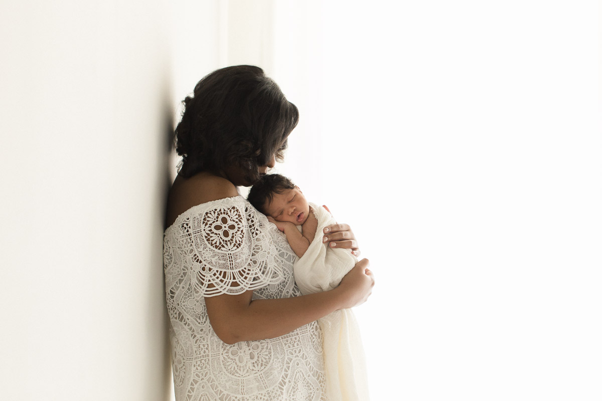 studio newborn lying on mother's chest photograph | Sweet Caroline Photographie