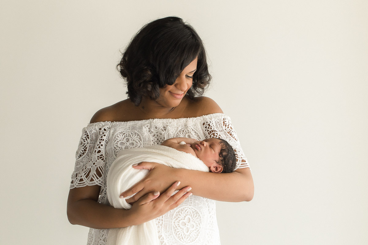 studio newborn in mother's arms photograph | Sweet Caroline Photographie